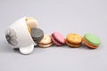 Coffee cup full of macaroon cakes Royalty Free Stock Photo