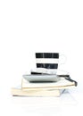 Coffee cup and glasses and calculator put on books stack on white backgrounds Royalty Free Stock Photo