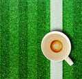 Coffee cup and grass.