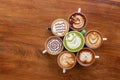 Coffee cup with Green Matcha latte art foam on wood table in coffee shop with copy space.Coffee is one of the most popular Royalty Free Stock Photo