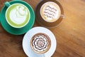 Coffee cup with Green Matcha latte art foam on wood table in coffee shop with copy space.Coffee is one of the most popular Royalty Free Stock Photo