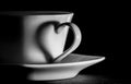 Coffee cup; the handle of the cup silhouettes a heart Royalty Free Stock Photo