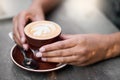 Coffee cup, hands on table with art for customer services, restaurant creativity and hospitality industry with Royalty Free Stock Photo