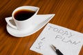 Coffee cup with handwriting today plan on napkin