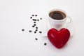 Coffee cup with heart and coffee beans