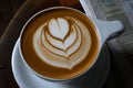 Coffee cup with heart in foam Royalty Free Stock Photo
