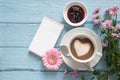 Coffee cup with a heart of milk foam, pink flowers and a writing Royalty Free Stock Photo