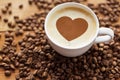 Coffee cup with heart and roasted beans Royalty Free Stock Photo