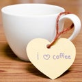 Coffee cup with heart tag write I love coffee word Royalty Free Stock Photo