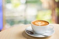 Coffee cup with hot coffee on old wood table in blur green natur Royalty Free Stock Photo