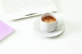 Coffee cup , laptop and lavender notpad on white table. Selective focus