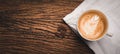 Coffee cup with latte art and beans on old wood table.there is space for ads,text,design and advertisement Royalty Free Stock Photo