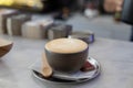 coffee cup latte art in cafe on wooden table.Classic Coffee Cup, Italian Cappuccino, Delicious Morning hot drink Royalty Free Stock Photo