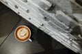 Coffee cup with latte art on the floor Royalty Free Stock Photo