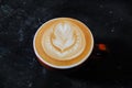 Coffee cup with latte art on the floor Royalty Free Stock Photo
