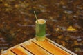 Coffee in a cup made of bamboo Put it on a wooden table in a stream Royalty Free Stock Photo