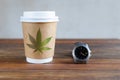 coffee cup with marijuana leaf and watch with the time 4:20