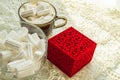 Coffee Cup with marshmallows ring in a box on the table with lace tablecloth, surprise concept for woman, selective Royalty Free Stock Photo