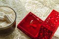 Coffee Cup with marshmallows ring in a box on the table with lace tablecloth, surprise concept for woman, selective Royalty Free Stock Photo