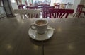 Coffee cup with milk over empty Cafe table Royalty Free Stock Photo