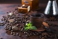 Coffee in cup and mint leaves on dark stone table. Royalty Free Stock Photo