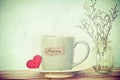 Coffee cup mug with red heart shapeand happy word tag on wooden Royalty Free Stock Photo