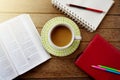 coffee cup,notebook,pencils on dark wooden table Royalty Free Stock Photo