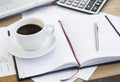 Coffee Cup at Office with Financial Papers,Agenda and Calculator Royalty Free Stock Photo