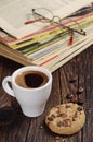 Coffee cup and old magazines Royalty Free Stock Photo