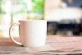 Coffee cup over newspaper on the table Royalty Free Stock Photo