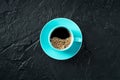 Coffee cup, overhead flat lay shot on a black slate background Royalty Free Stock Photo