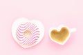 Coffee cup and pink donut in heart shape plate. Valentines Day concept. Top view, copy space. Royalty Free Stock Photo