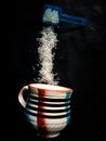 Coffee cup and sugar fall Royalty Free Stock Photo