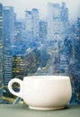 Coffee cup on a rainy day in front of the window Royalty Free Stock Photo