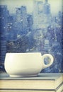 Coffee cup on a rainy day in front of the window Royalty Free Stock Photo