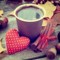 Coffee cup, red heart and autumn still life on table Royalty Free Stock Photo
