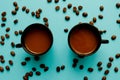 Coffee cup and roasted beans arranged as clock face on blue background, top view. Coffee time symbol. Interesting idea energy and Royalty Free Stock Photo