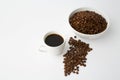 Coffee cup with roasted beans on white background. Top view with copy space Royalty Free Stock Photo