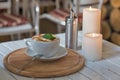 Coffee cup and romantic candles closeup Royalty Free Stock Photo
