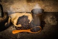 Coffee cup sack scoop of coffee beans and kettle on the old wood Royalty Free Stock Photo