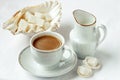 Coffee cup and saucer with milk and sugar on white background Royalty Free Stock Photo