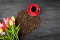 Coffee cup, coffee beans and tulips