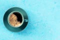 Coffee cup, shot from above on a blue background with copy space Royalty Free Stock Photo