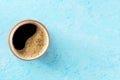 Coffee cup, shot from above on a blue background with a place for text Royalty Free Stock Photo