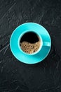 Coffee cup, shot from the top on a black slate background with copy space Royalty Free Stock Photo