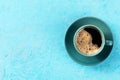 Coffee cup, shot from the top on a blue background with a place for text Royalty Free Stock Photo