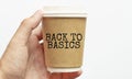 Coffee cup with sign BACK TO BASICS, business concept Royalty Free Stock Photo