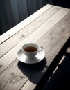 A coffee cup with singleorigin coffee rests on a saucer on a table Royalty Free Stock Photo