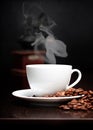 Coffee cup with smoke and grain Royalty Free Stock Photo