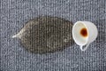 Coffee cup spilled on the carpet Royalty Free Stock Photo